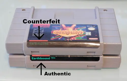 Close-up comparison of the end label on Earthbound SNES cartridges, highlighting font clarity, color accuracy, and differences between authentic and counterfeit versions.