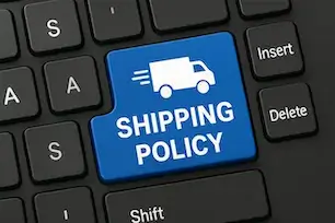 Keyboard with a blue key labeled 'Shipping Policy' featuring a delivery truck icon, symbolizing shipping instructions for sending games.
