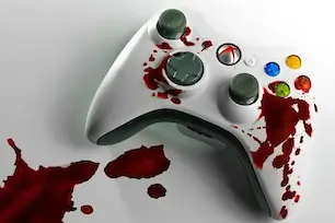 Blood-stained game controller symbolizing debates around violence and player choice in video games.