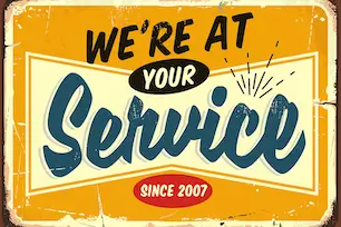 Vintage-style sign reading 'We're at Your Service – Since 2007' in retro fonts with distressed edges and warm colors.