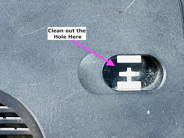 Step 3 - Clean the hole where the Reset button is