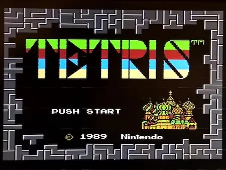 NES Tetris intro screen displaying the classic title logo with block-style lettering and the iconic start menu layout.