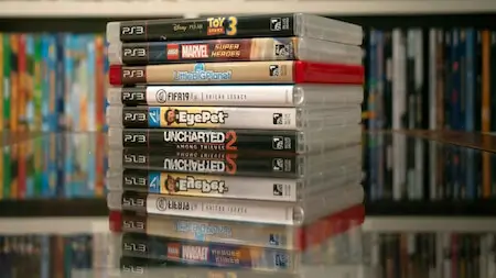 Sell PS3 games online – stack of PlayStation 3 game cases with artwork visible