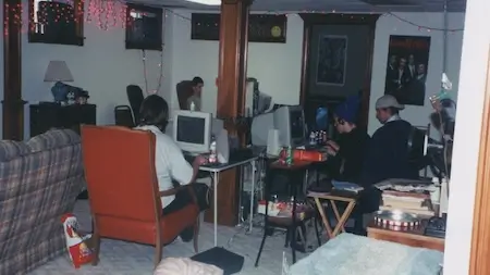 College gamers playing multiplayer PC games at a LAN party.