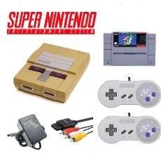 Yellowed Super Nintendo console bundle with Super Mario World, 2 controllers, AV cable, and adapter